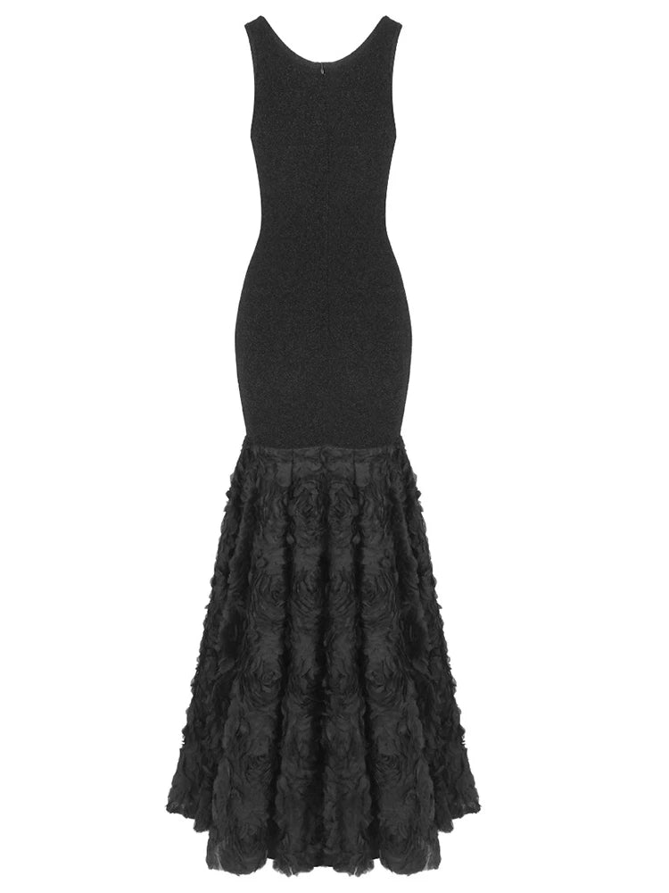 Back view of black mermaid dress on mannequin showing the floral hem 